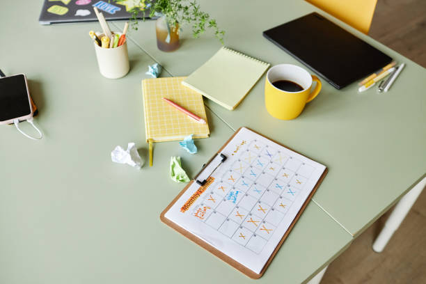 Colour-coded monthly walk calendar on a cottage-style desk