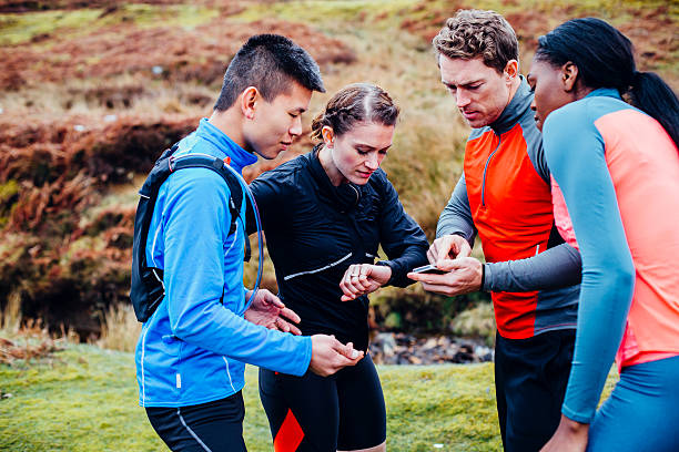 Walker checking route schedule on phone before group walk